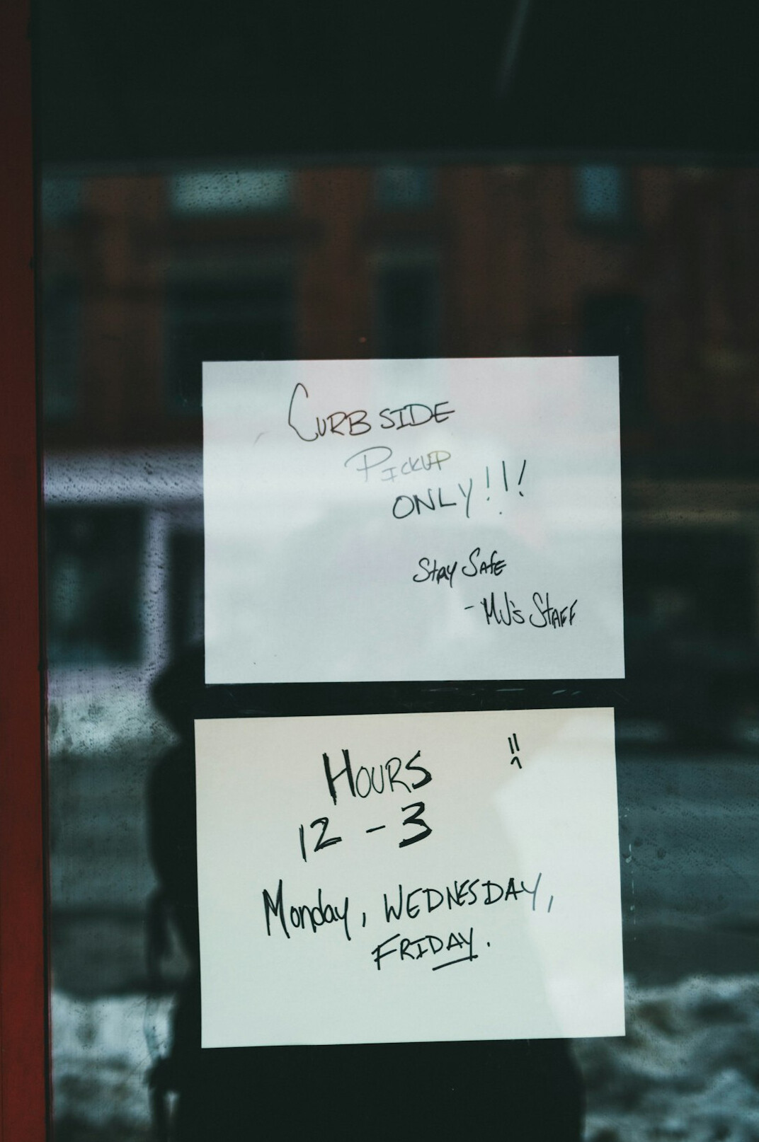 Close-up of a whiteboard covered with business strategy diagrams and sticky notes