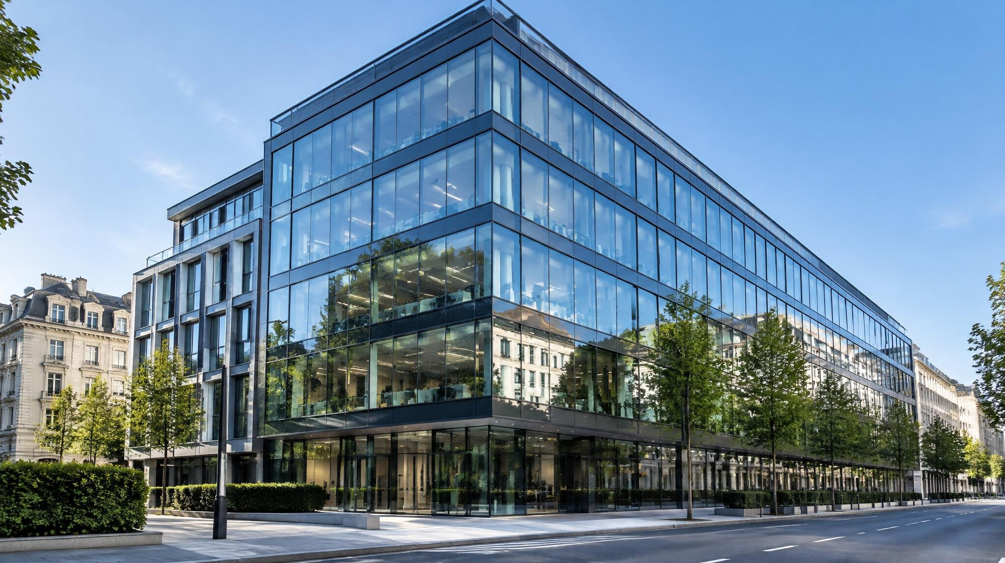 Modern glass office building exterior in a European city during daylight